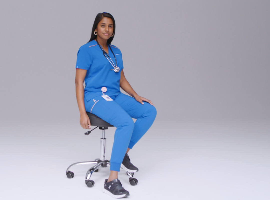 female nurse in blue scrubs