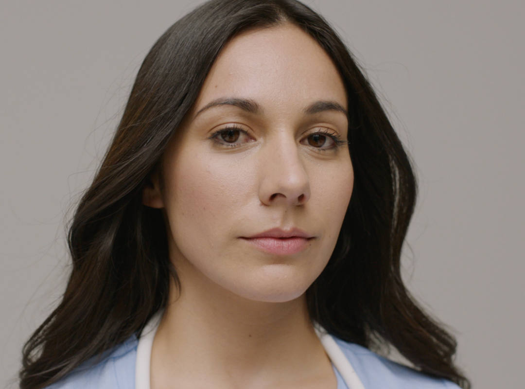 female nurse in sky blue scrubs